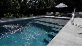 Fiberglass pool installation with concrete patio and retaining wall. Start to finish.