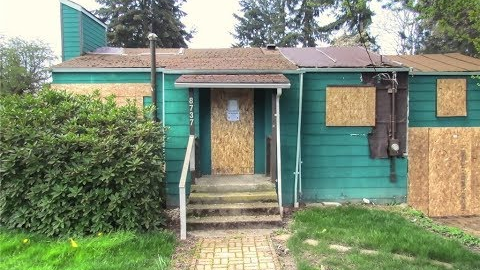 Flip this house!  Boarded up Seattle home up for sale at $450k