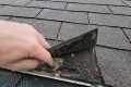 Roof leaking behind gutter into the