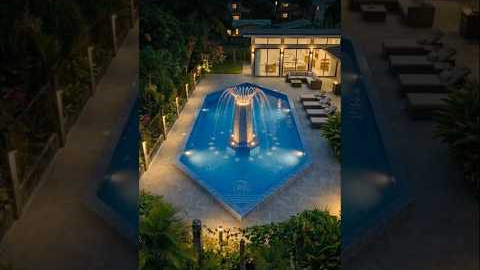 Building a modern resort pool with fountain.